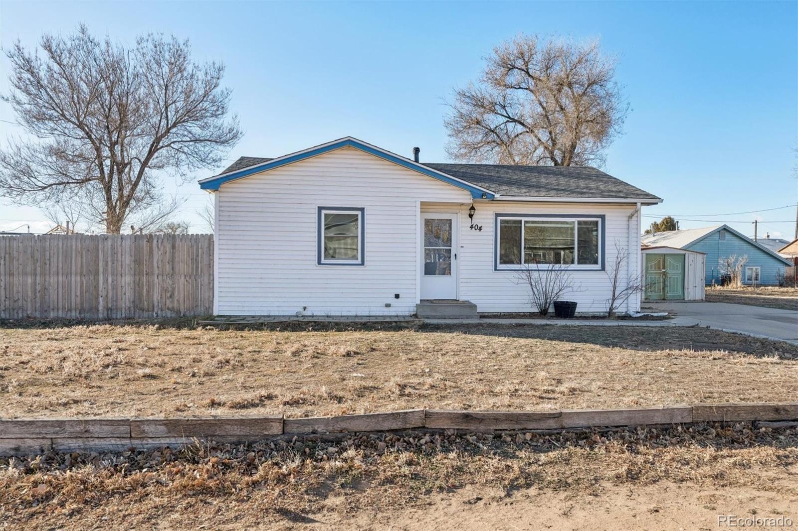 a house with trees in the background