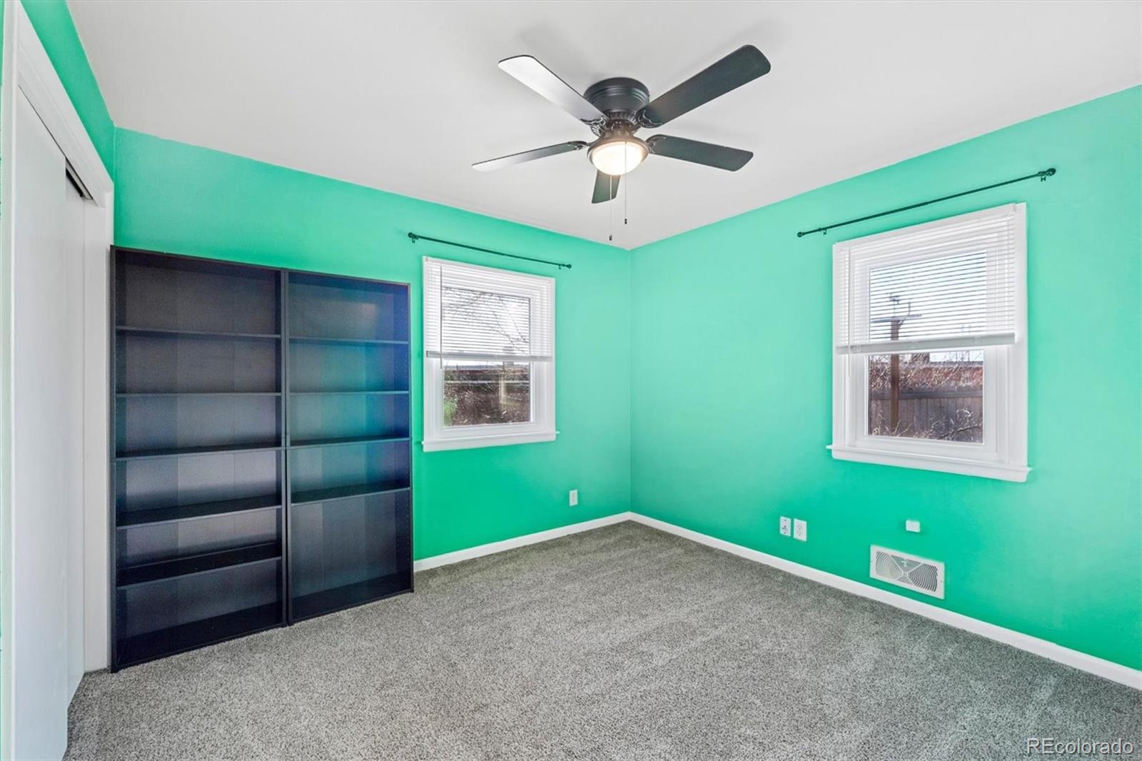 404 10th Street Gilcrest, CO 80623 - Photo 13 of 18 a room with window and ceiling fan