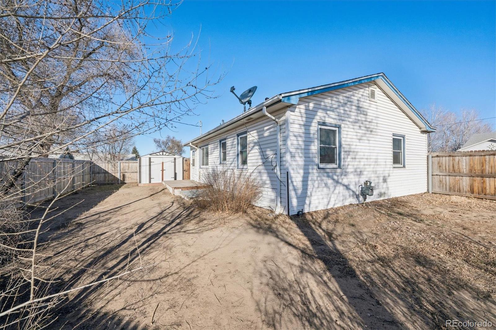 404 10th Street Gilcrest, CO 80623 - Photo 17 of 18 a view of backyard of house