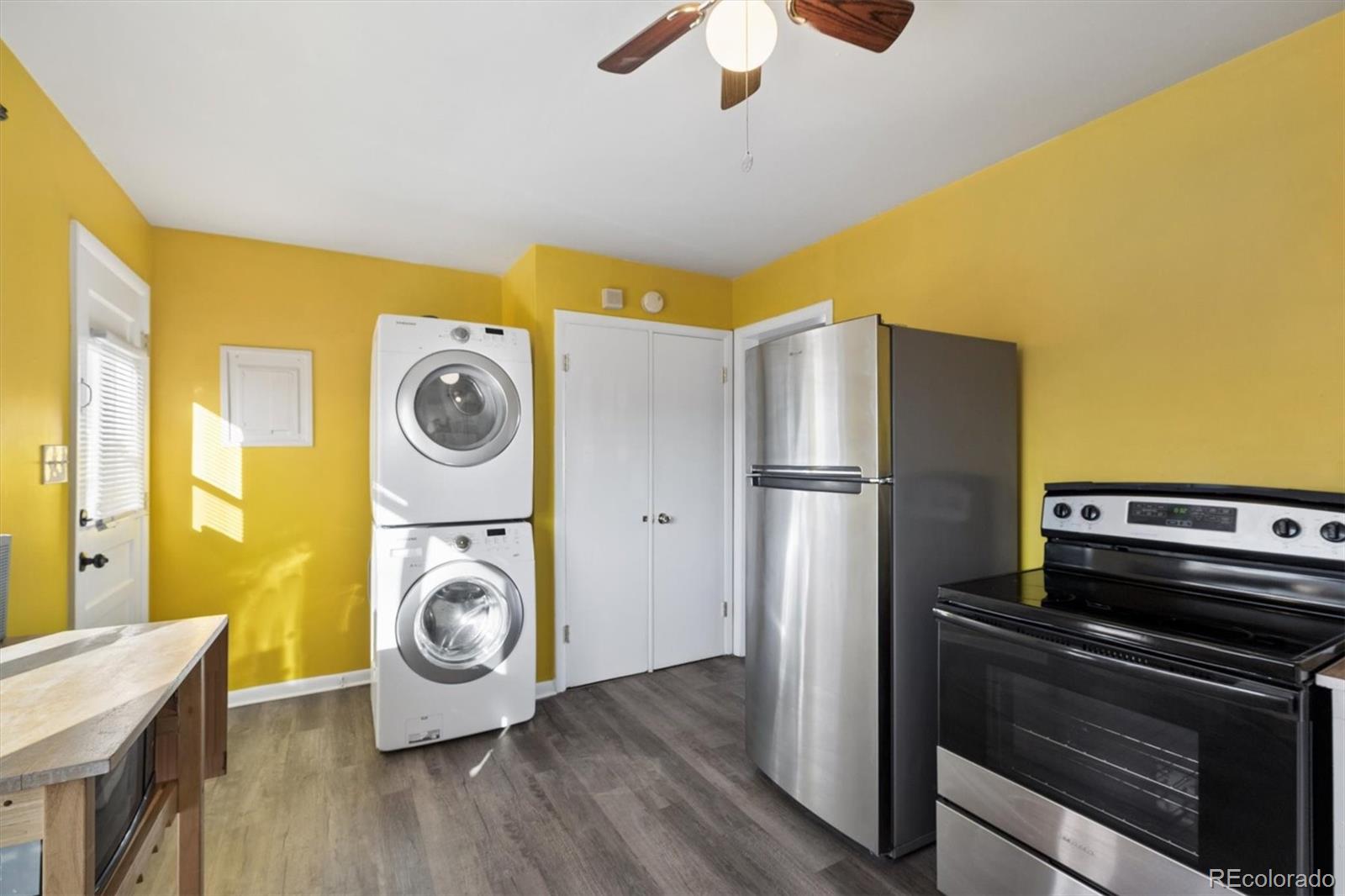 404 10th Street Gilcrest, CO 80623 - Photo 8 of 18 a kitchen with a refrigerator and a stove top oven