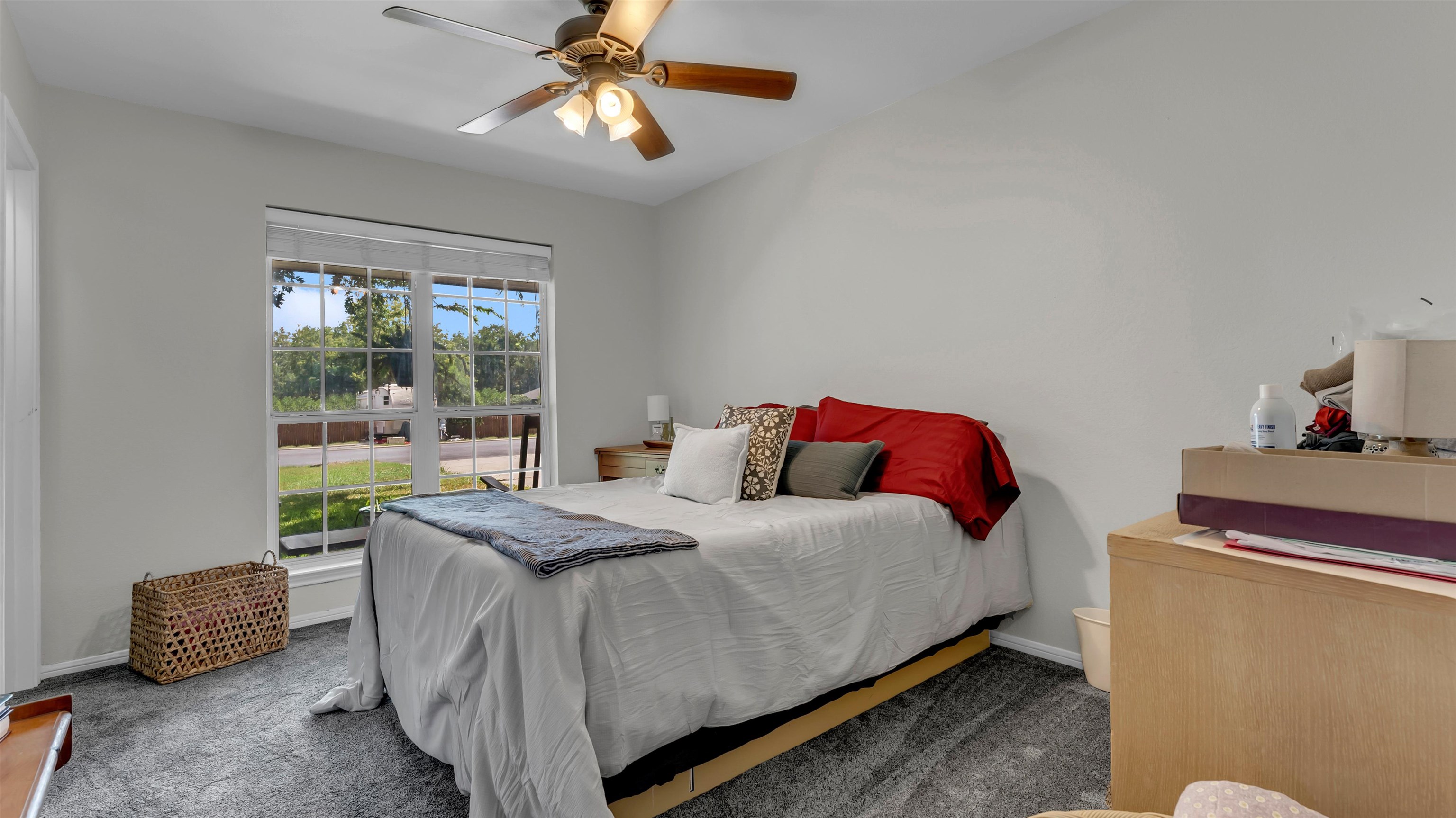 1004 East Johnson Street Burnet, TX 78611 - Photo 16 of 23 a bedroom with a bed and a chandelier
