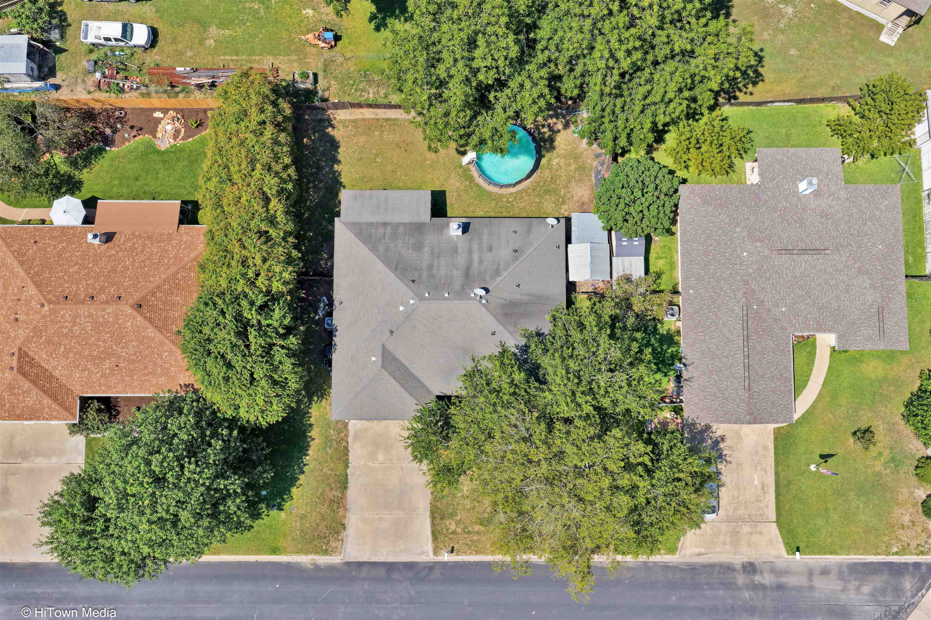 1004 East Johnson Street Burnet, TX 78611 - Photo 20 of 23 an aerial view of a house with garden space and street view