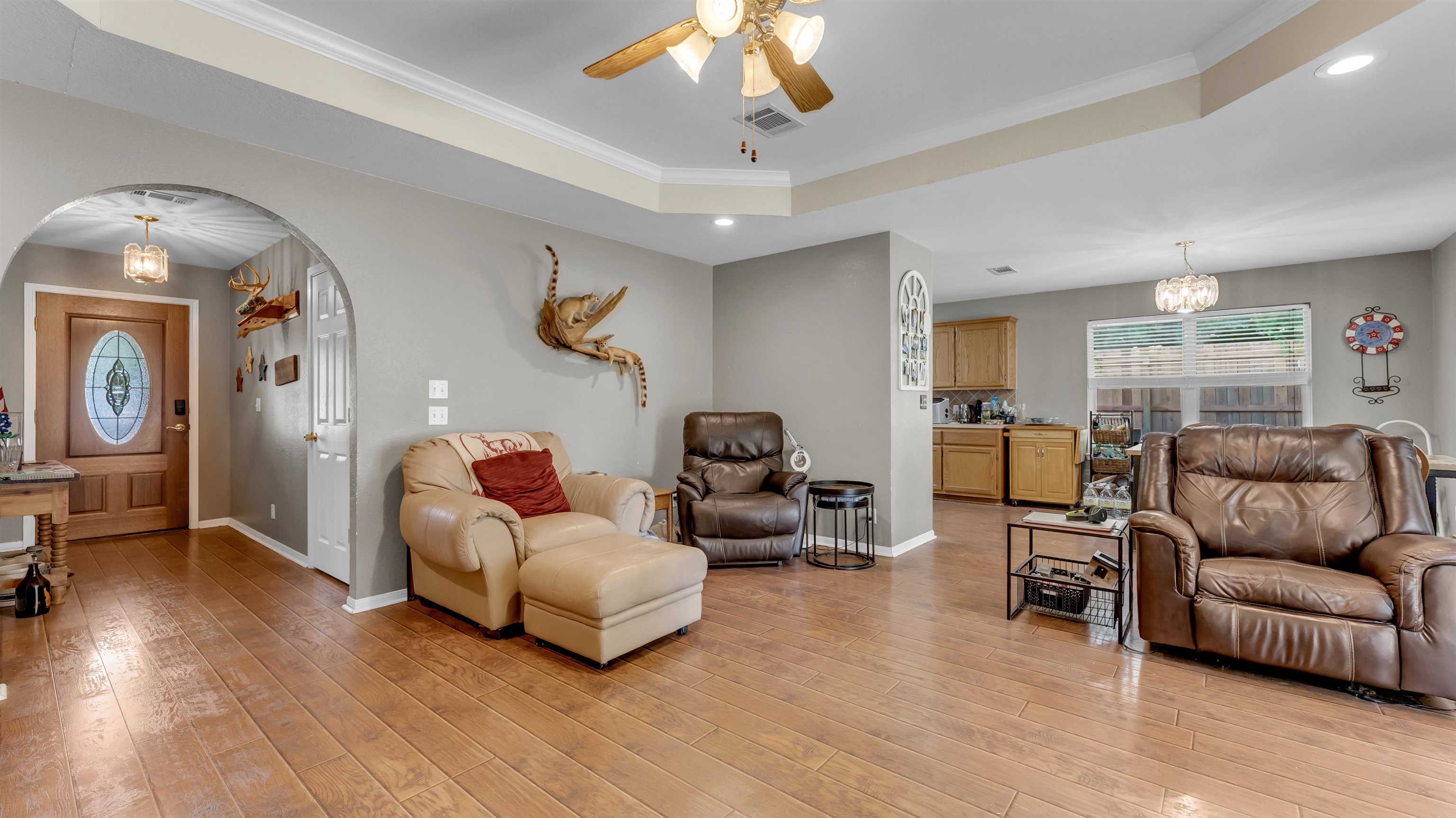 1004 East Johnson Street Burnet, TX 78611 - Photo 3 of 23 a living room with furniture and a chandelier
