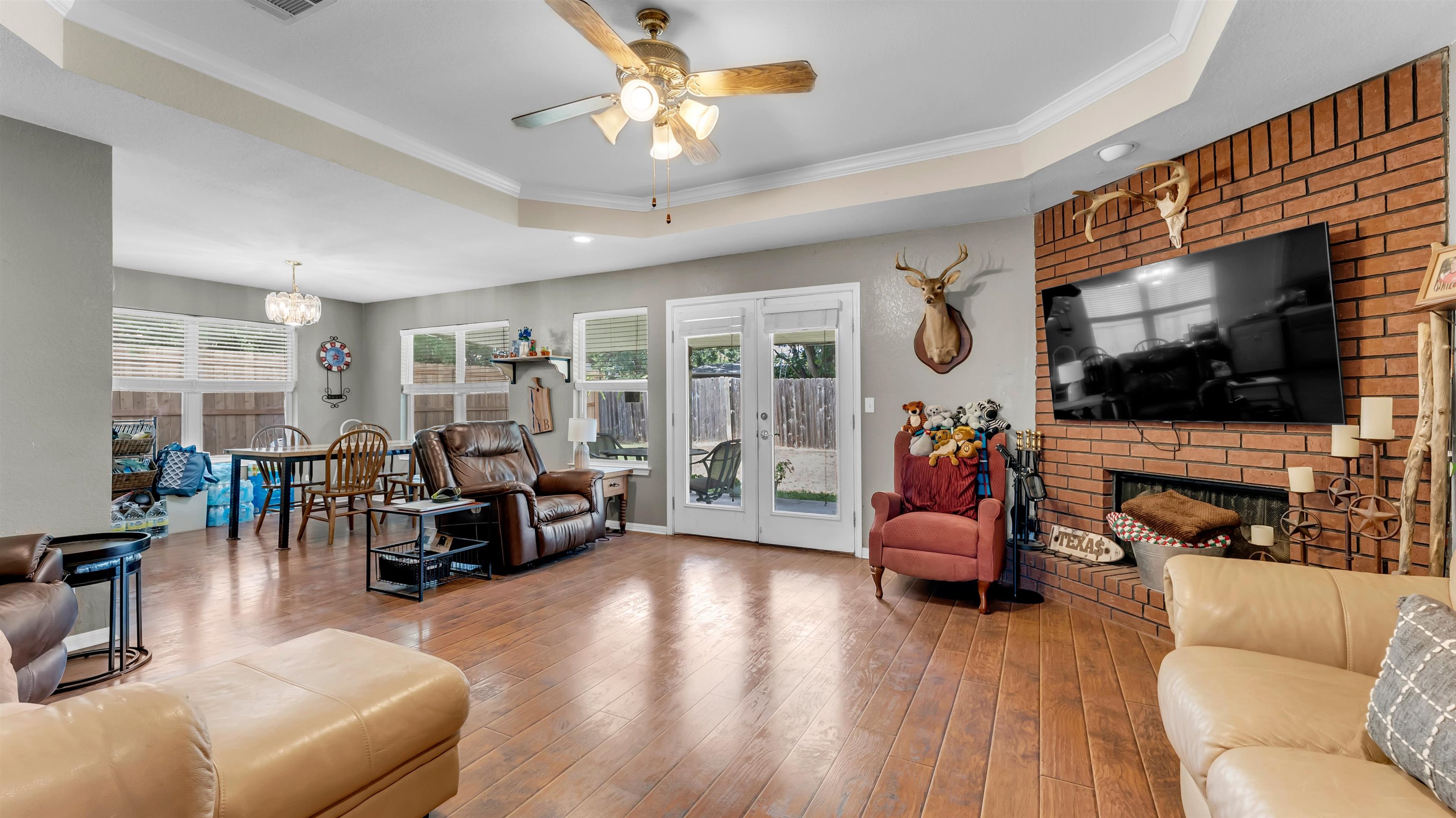 1004 East Johnson Street Burnet, TX 78611 - Photo 4 of 23 a living room with furniture and a flat screen tv
