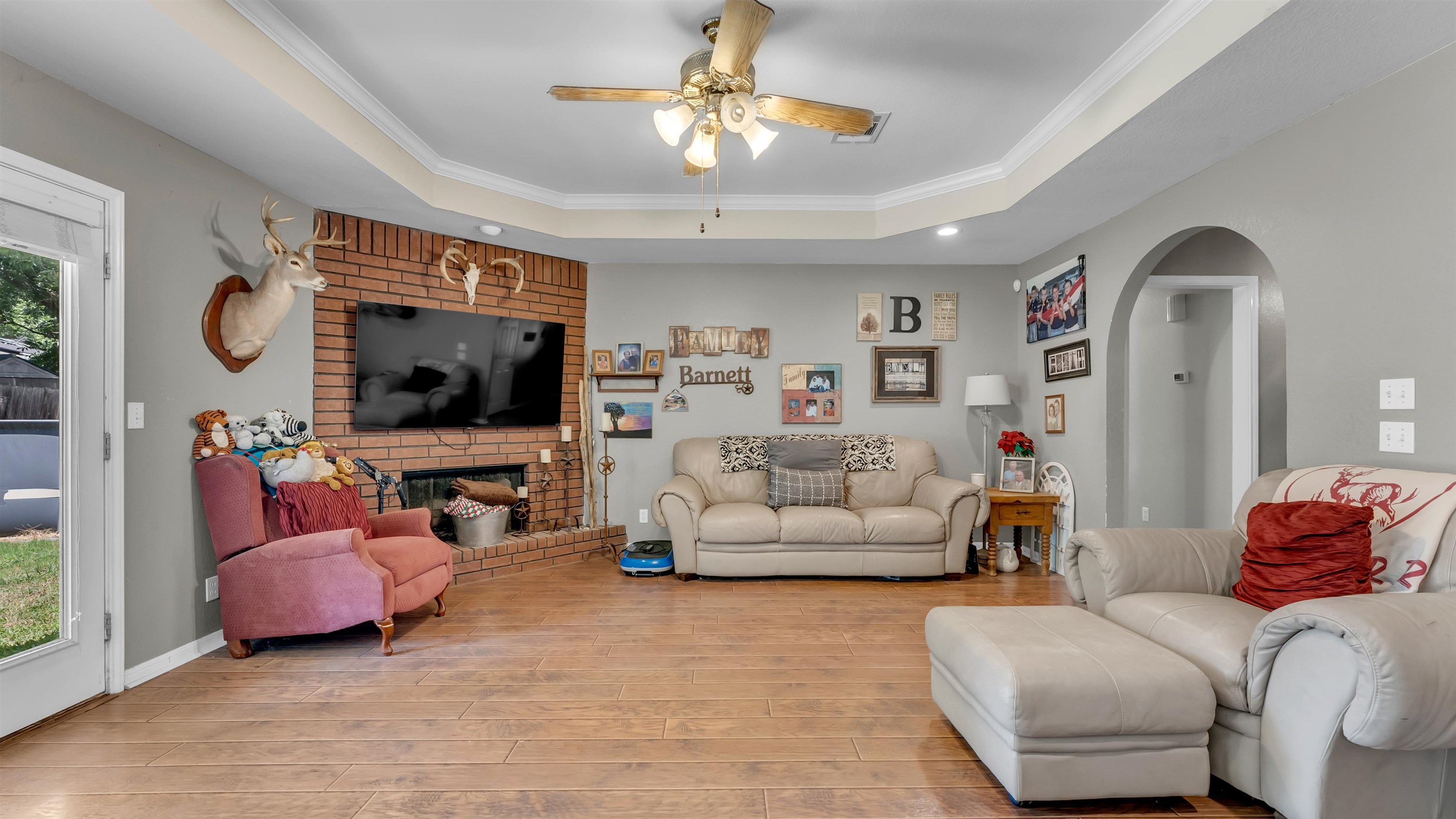 1004 East Johnson Street Burnet, TX 78611 - Photo 5 of 23 a living room with furniture and a flat screen tv