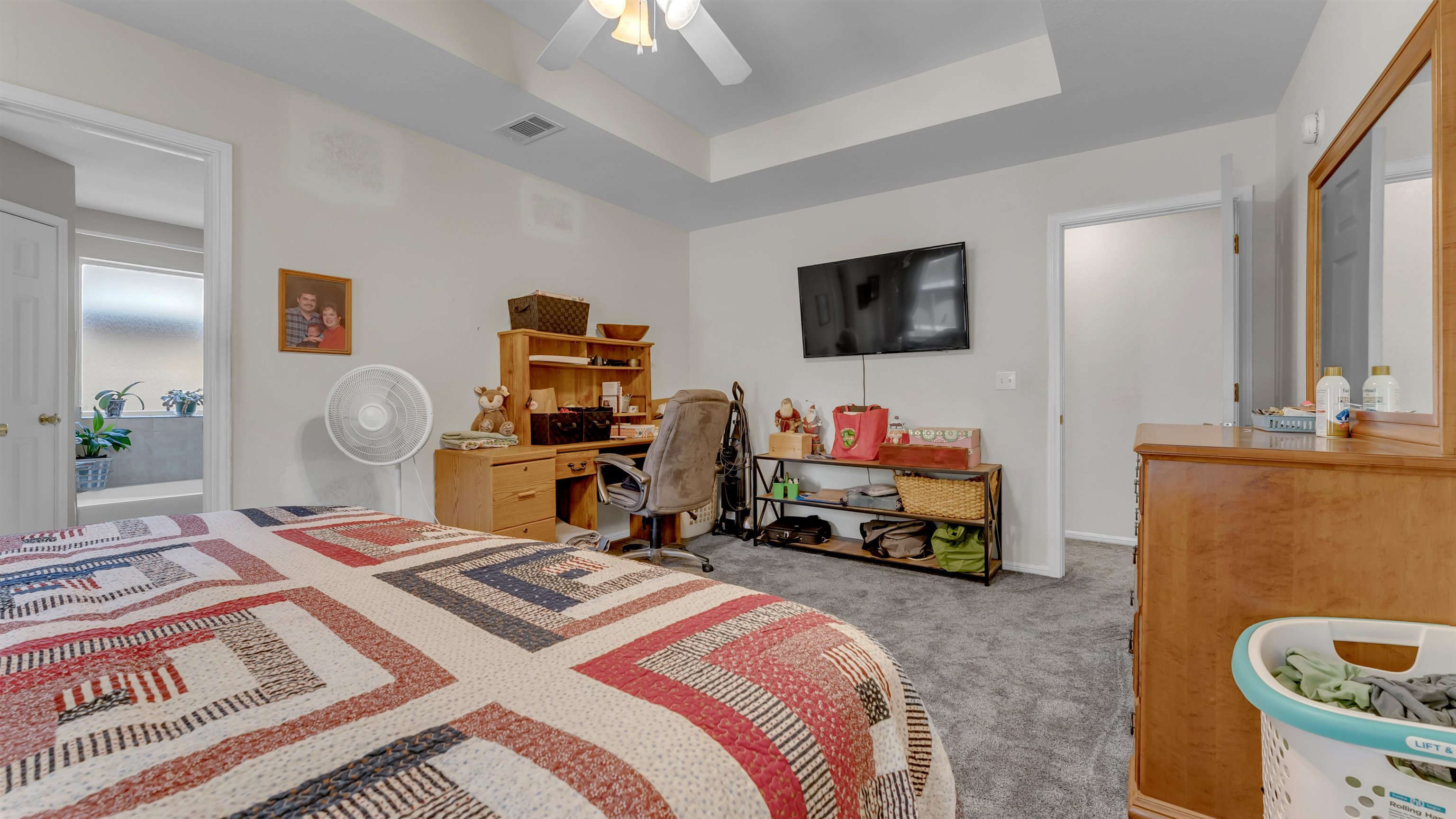 1004 East Johnson Street Burnet, TX 78611 - Photo 10 of 23 a bedroom with a bed and a tv on the table