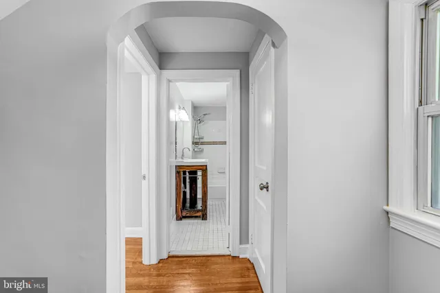 a view of walk in closet with living room