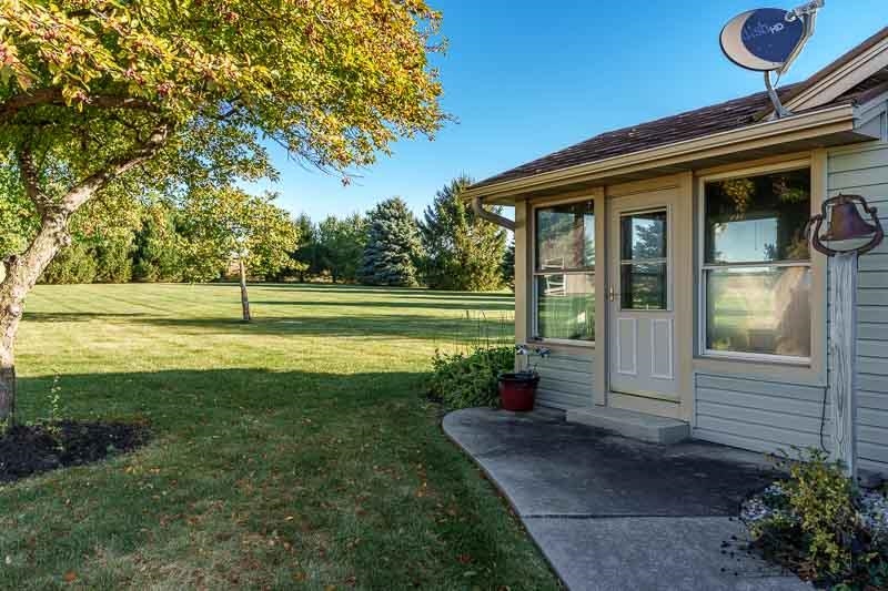 13755 Baker Road Durand, IL 61024 - Photo 42 of 58 a view of a house with a yard