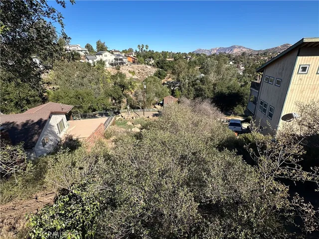 a view of a house with a mountain ground