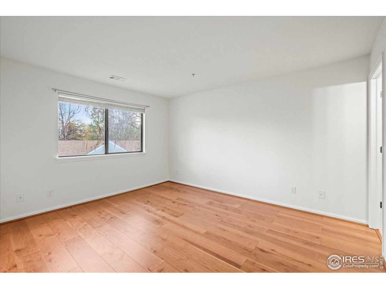 4945 Twin Lakes Road, Unit 39 Boulder, CO 80301 - Photo 11 of 24 The primary bedroom can accommodate a king-sized bed.