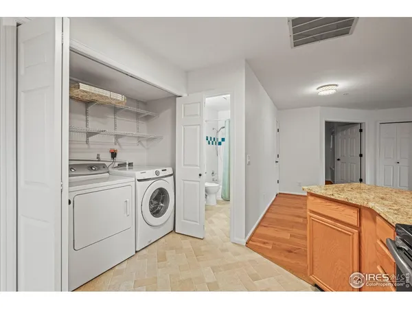 a utility room with sink dryer and washer