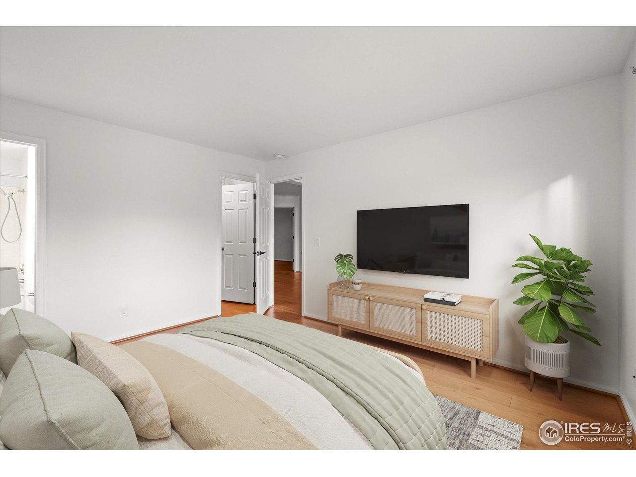 4945 Twin Lakes Road, Unit 39 Boulder, CO 80301 - Photo 12 of 24 The primary bedroom has a large walk-in closet and ensuite bathroom (virtually staged).