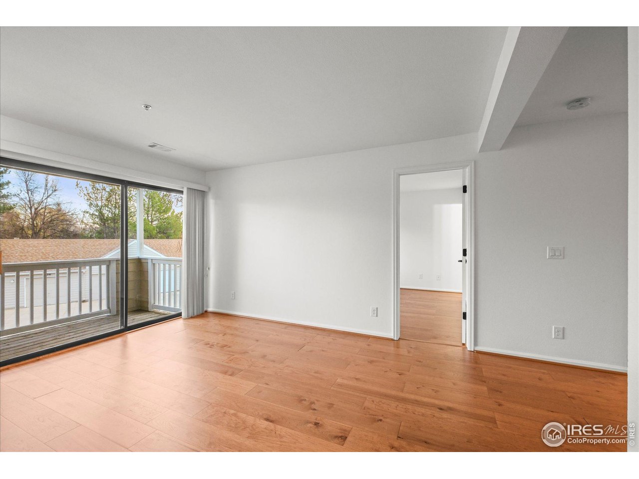 4945 Twin Lakes Road, Unit 39 Boulder, CO 80301 - Photo 20 of 24 The primary bedroom is next to the living room.