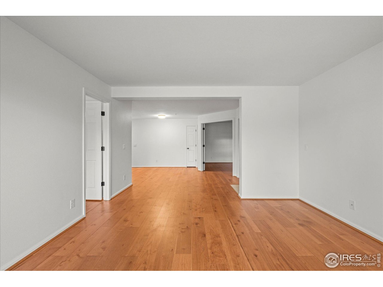 4945 Twin Lakes Road, Unit 39 Boulder, CO 80301 - Photo 21 of 24 The living room flows to the second bedroom and dining area.