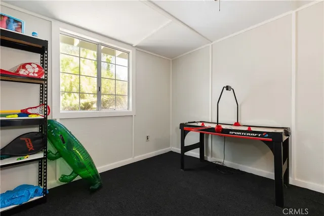 an empty room with ceiling fan