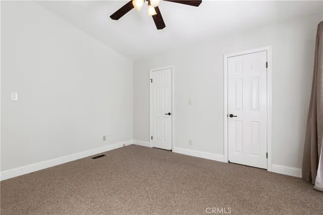 a view of a backyard with tree