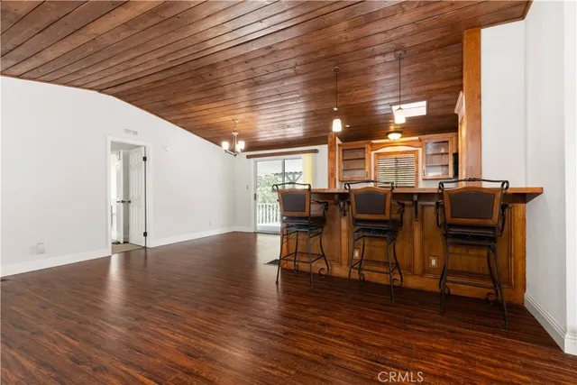a view of a livingroom with furniture and a flat screen tv
