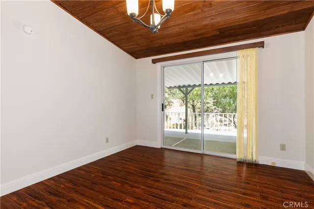 a kitchen with granite countertop cabinets and window