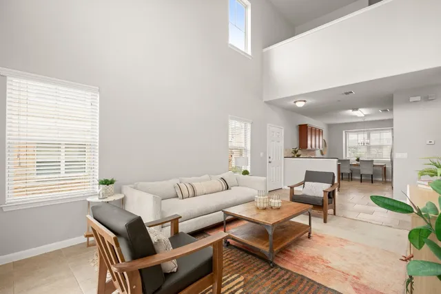 a living room with furniture and a window
