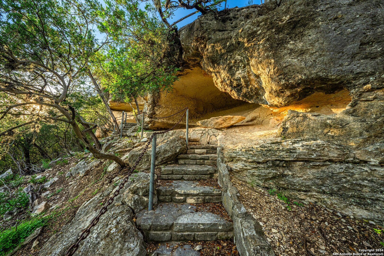240 River Bend Road West Hunt, TX 78024 - Photo 37 of 45 a backyard of a building with large trees