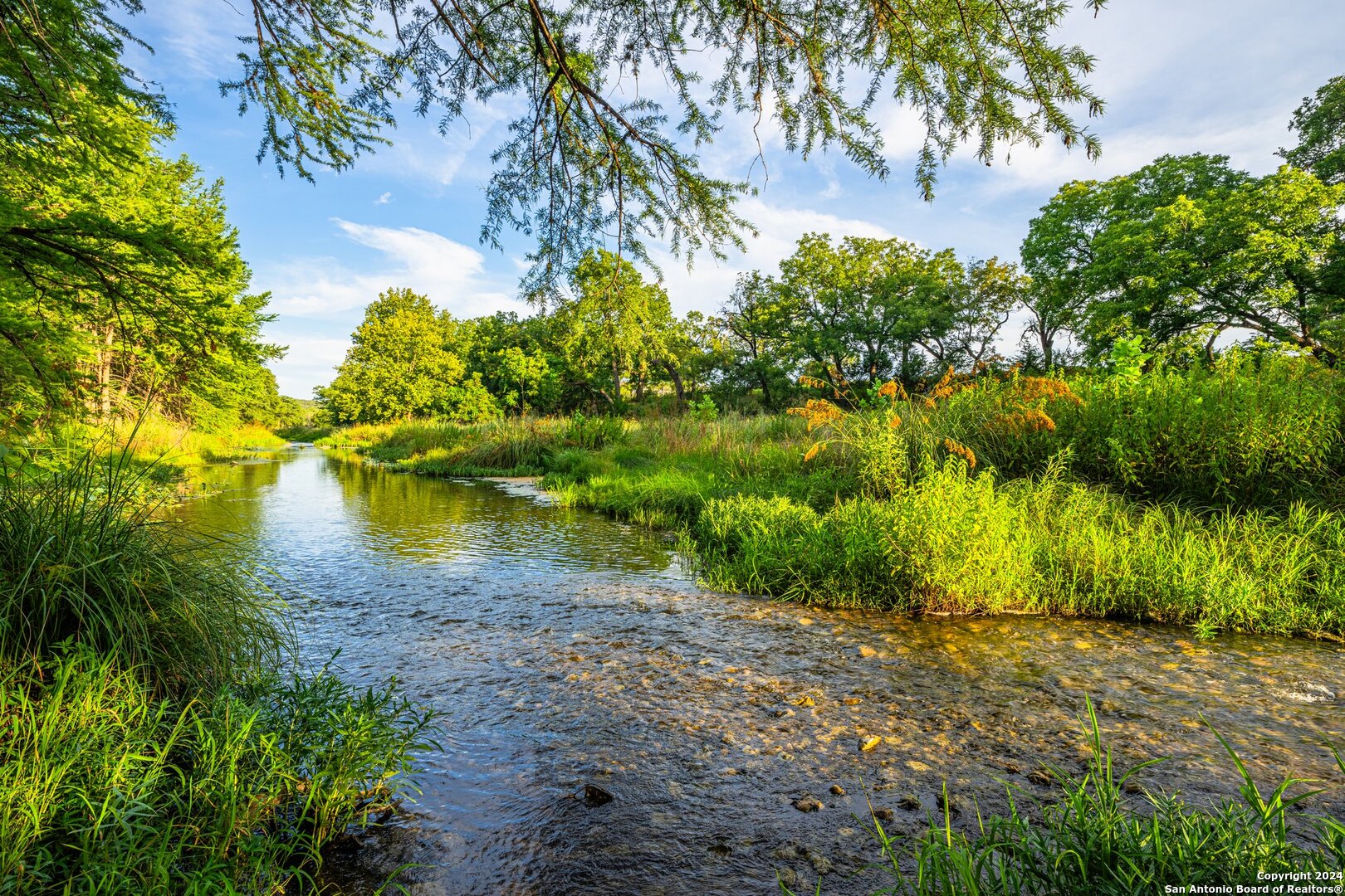 240 River Bend Road West Hunt, TX 78024 - Photo 5 of 45 a view of a lake with a yard