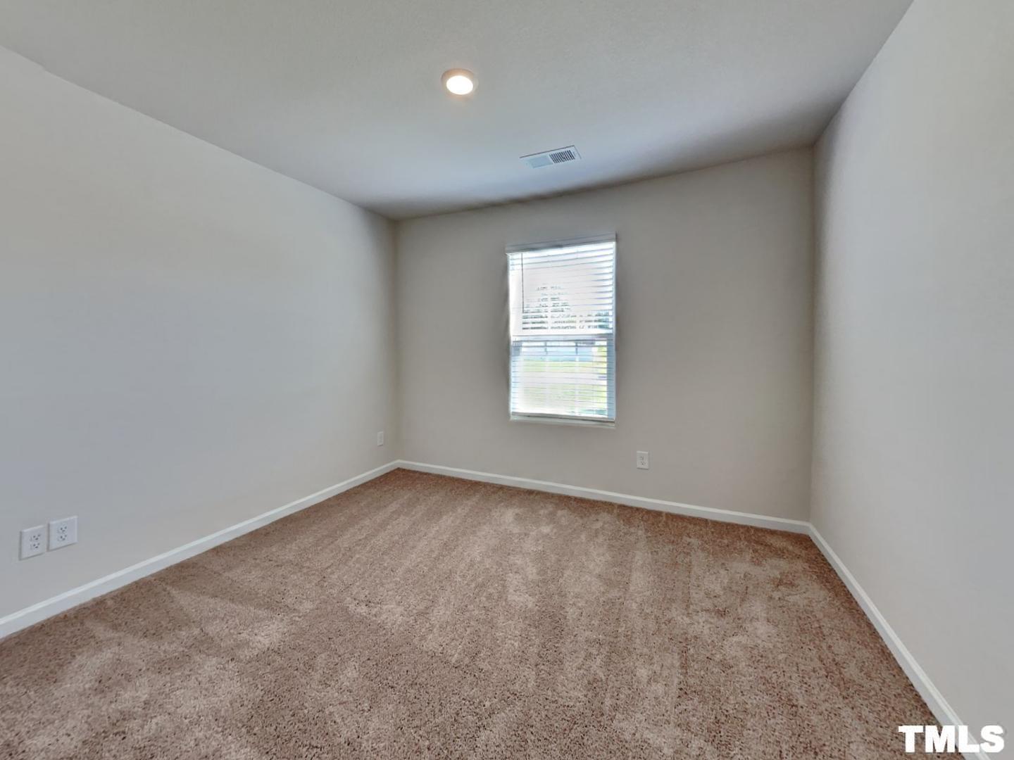 175 Coleshill Road Angier, NC 27501 - Photo 11 of 16 an empty room with a window