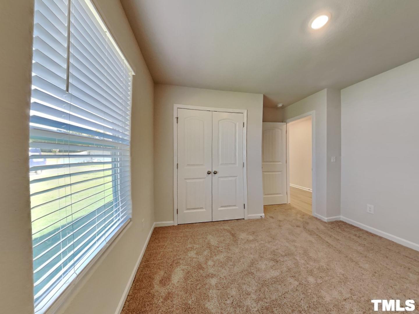 175 Coleshill Road Angier, NC 27501 - Photo 14 of 16 a view of an empty room and a window