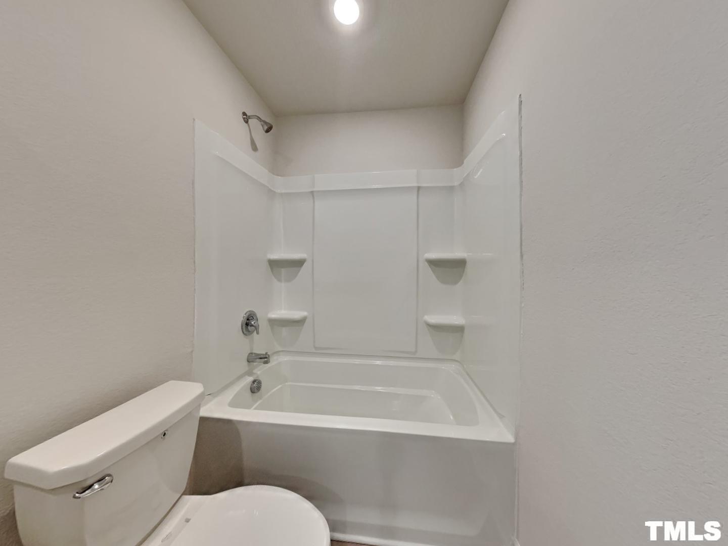 175 Coleshill Road Angier, NC 27501 - Photo 15 of 16 a white bath tub sitting next to a white toilet