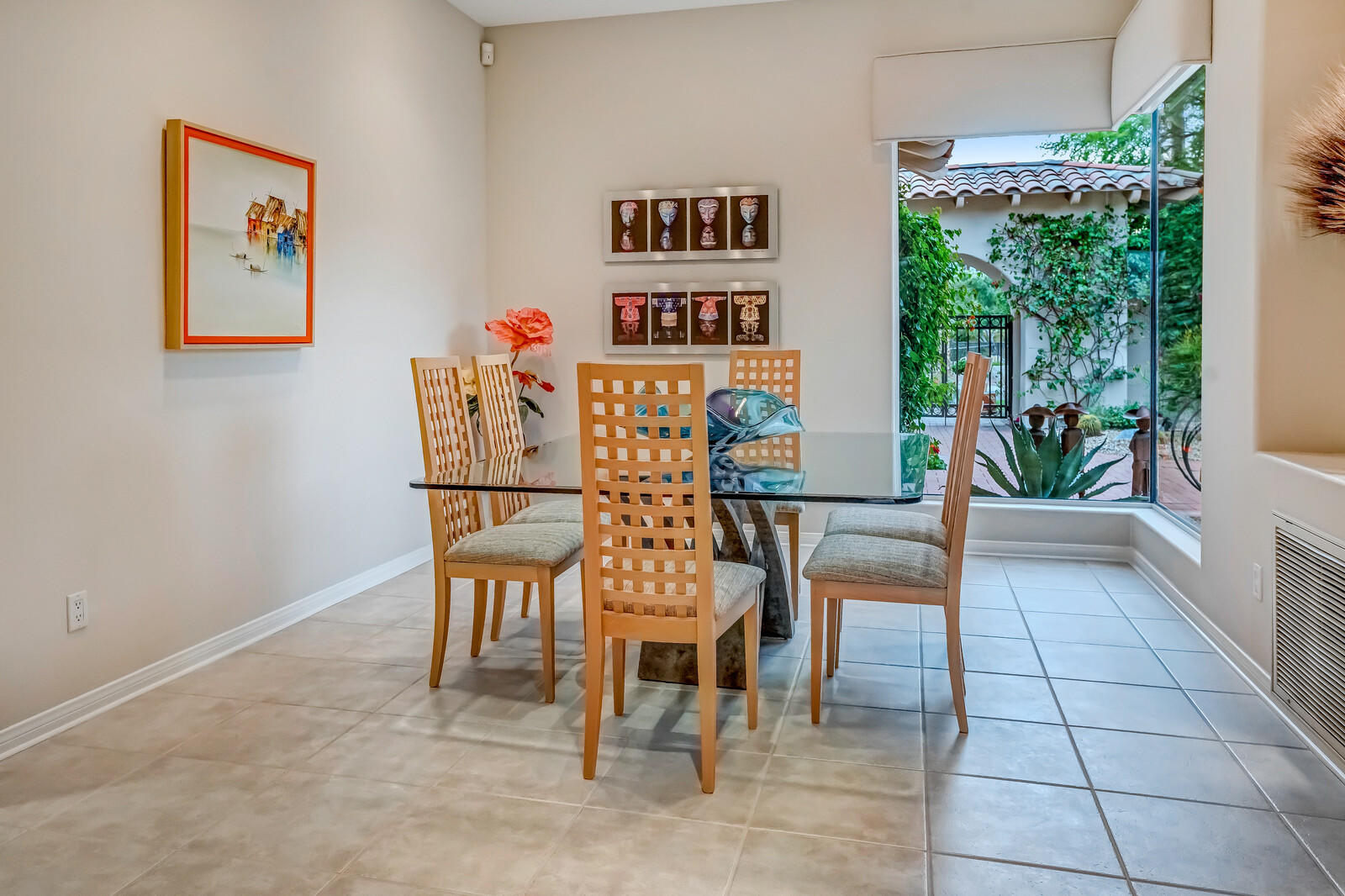 128 Loch Lomond Road Rancho Mirage, CA 92270 - Photo 14 of 42 a view of a dining room with furniture one side kitchen view and a window