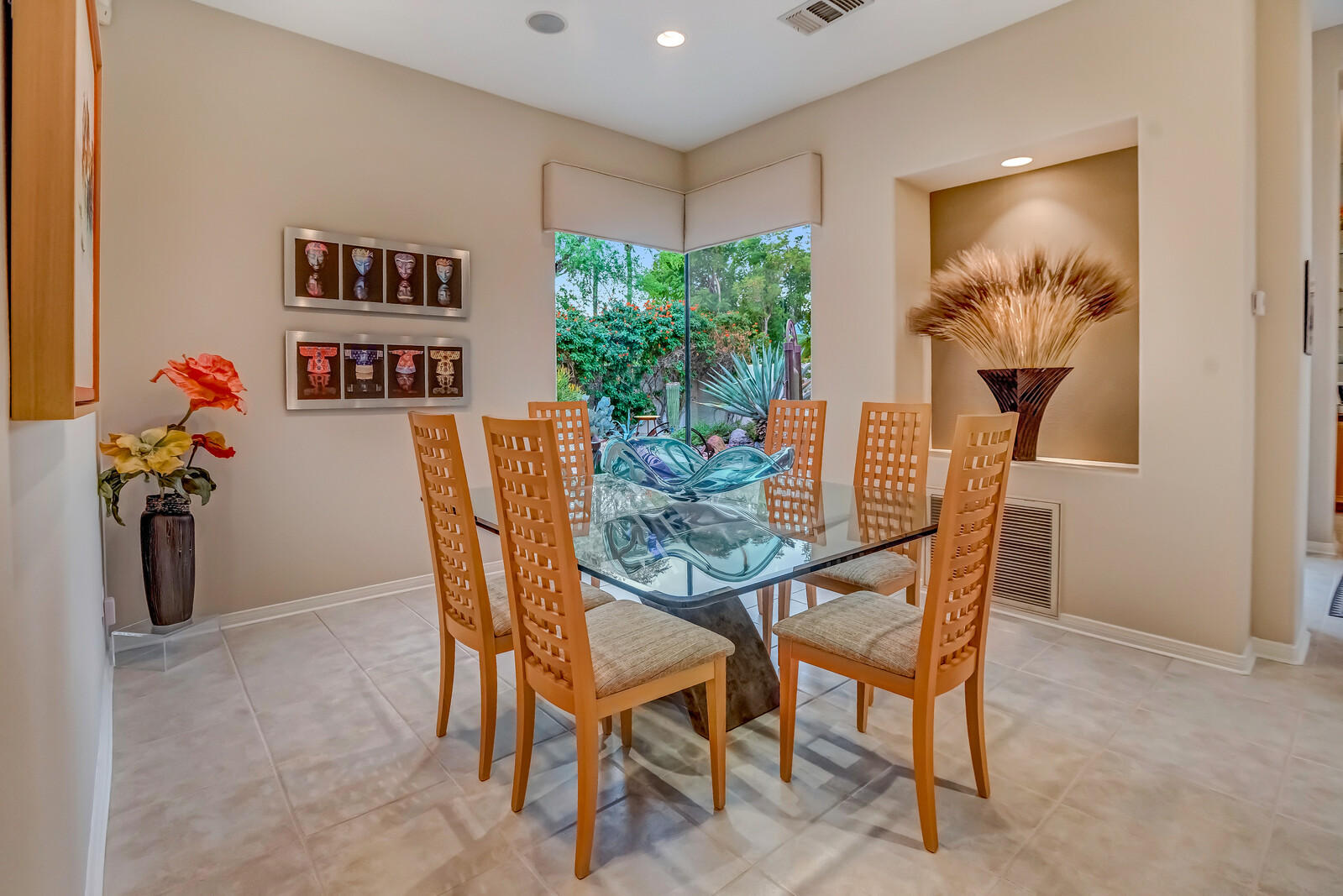 128 Loch Lomond Road Rancho Mirage, CA 92270 - Photo 15 of 42 a view of a dining room with furniture and chandelier