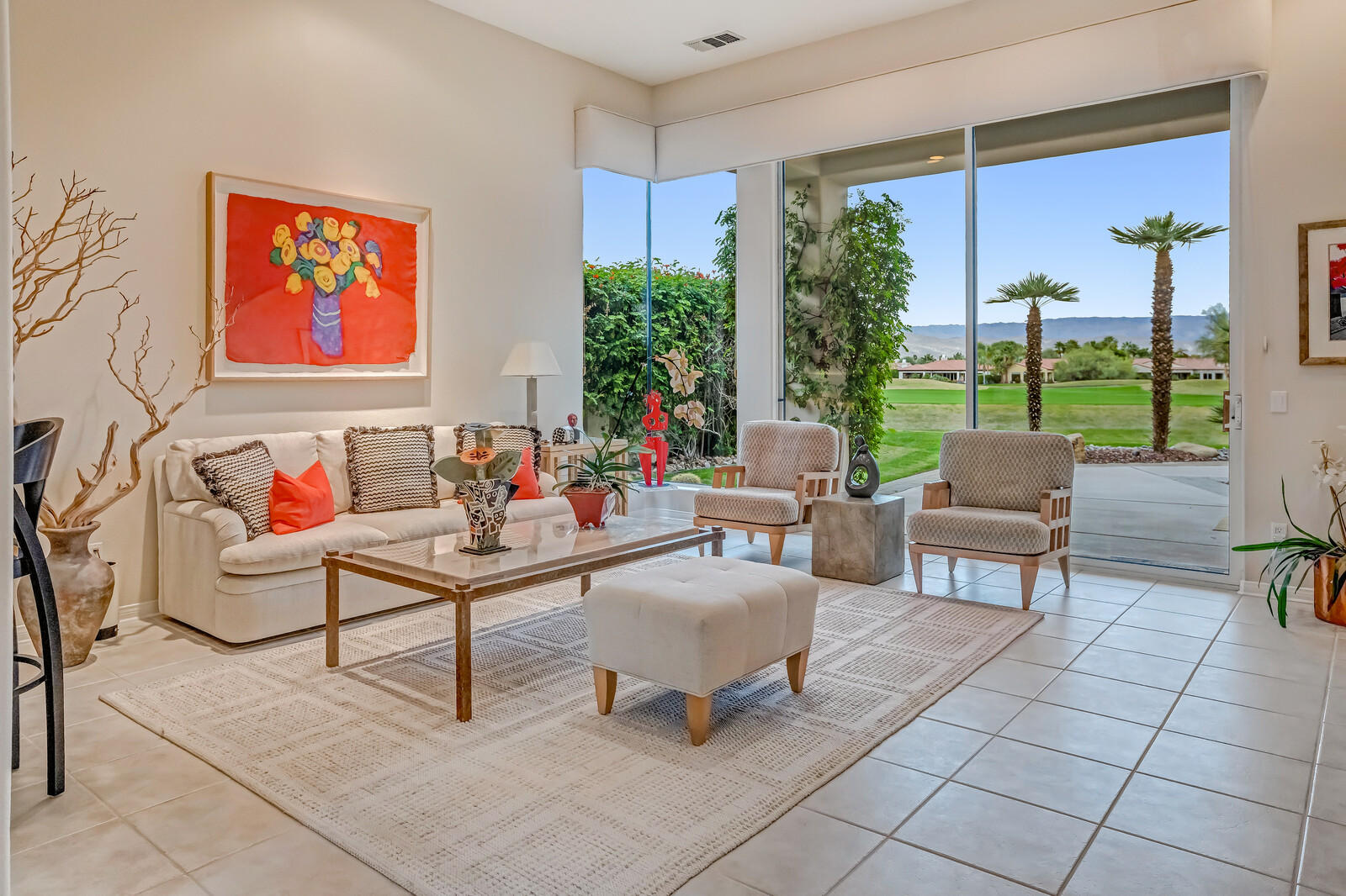 128 Loch Lomond Road Rancho Mirage, CA 92270 - Photo 19 of 42 a outdoor space with patio couches and a potted plant on a coffee table