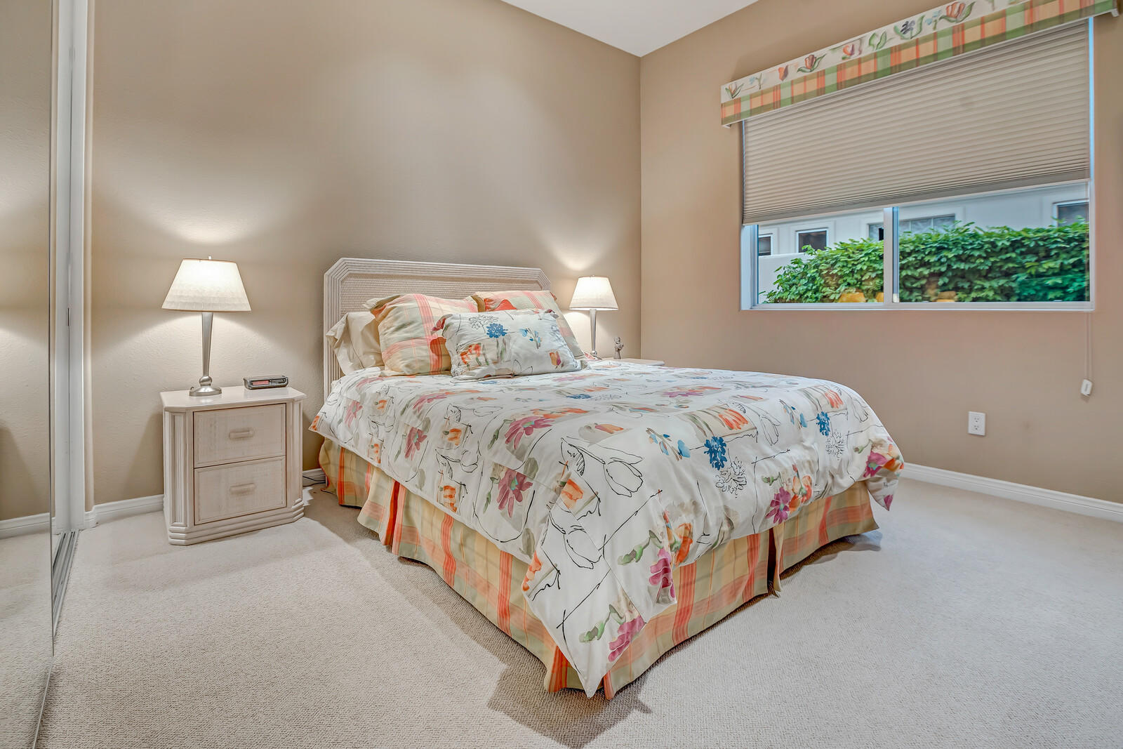 128 Loch Lomond Road Rancho Mirage, CA 92270 - Photo 27 of 42 a bedroom with a bed lamp and a window