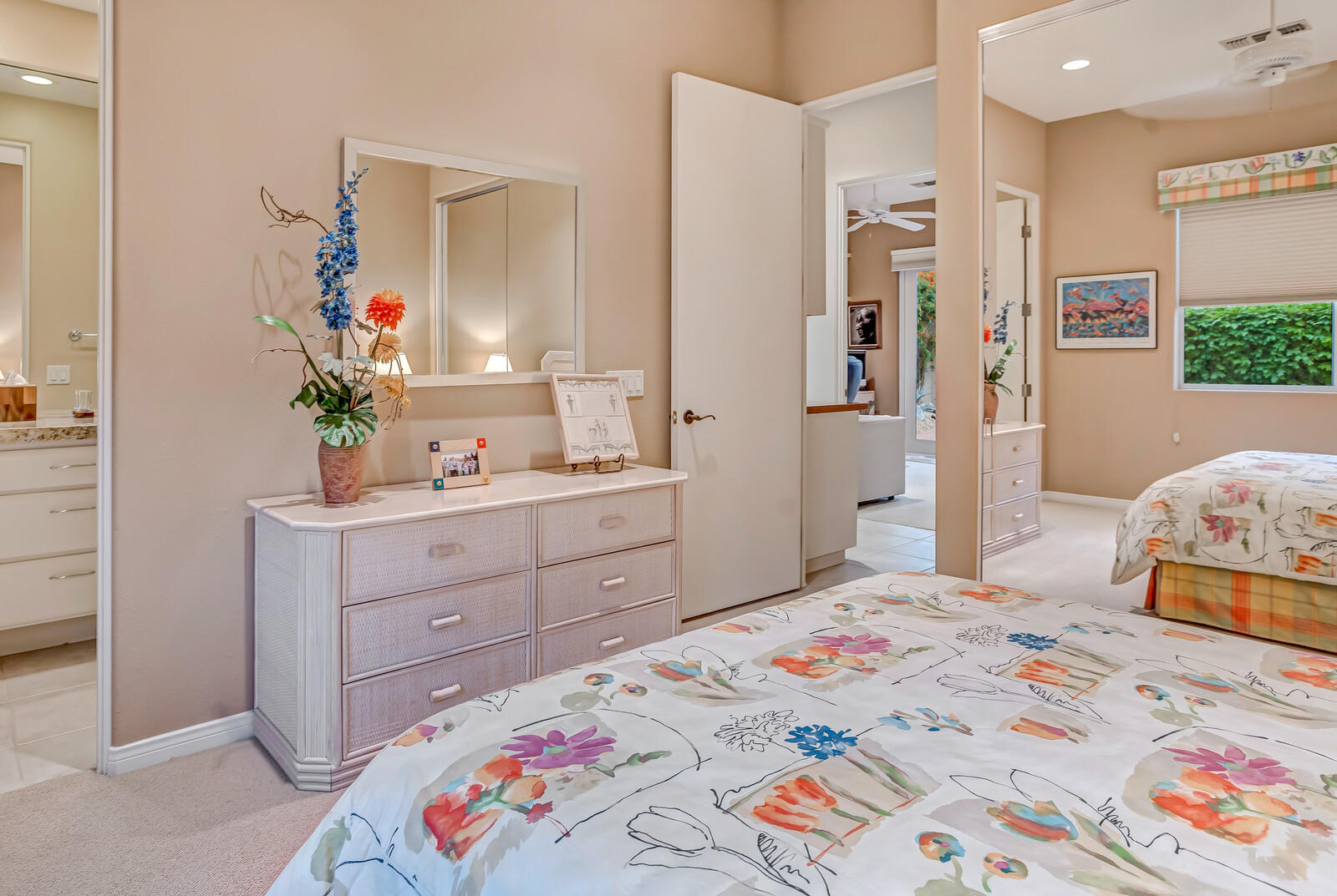 128 Loch Lomond Road Rancho Mirage, CA 92270 - Photo 29 of 42 a bedroom with a bed and a dresser in it