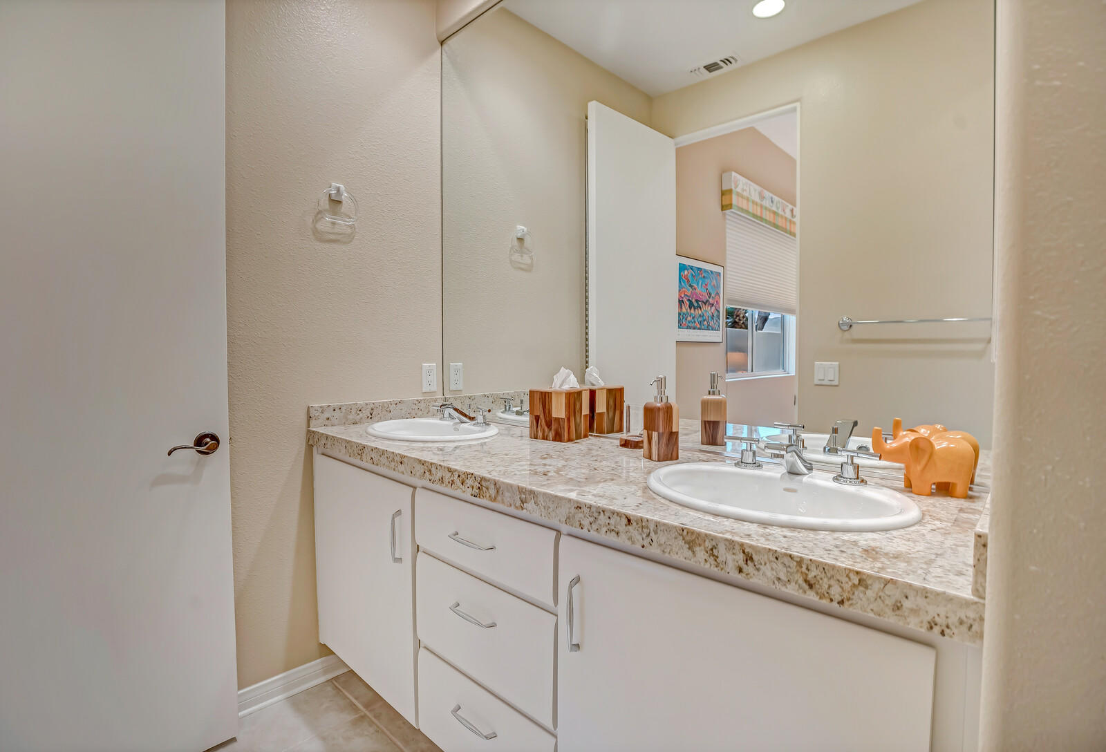128 Loch Lomond Road Rancho Mirage, CA 92270 - Photo 30 of 42 a bathroom with a sink double vanity and a mirror