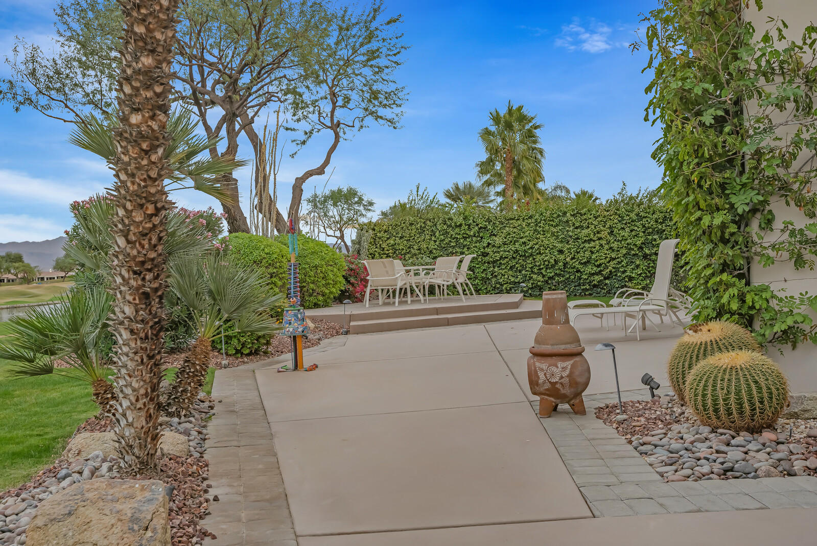 128 Loch Lomond Road Rancho Mirage, CA 92270 - Photo 38 of 42 a view of balcony with chairs and potted plants