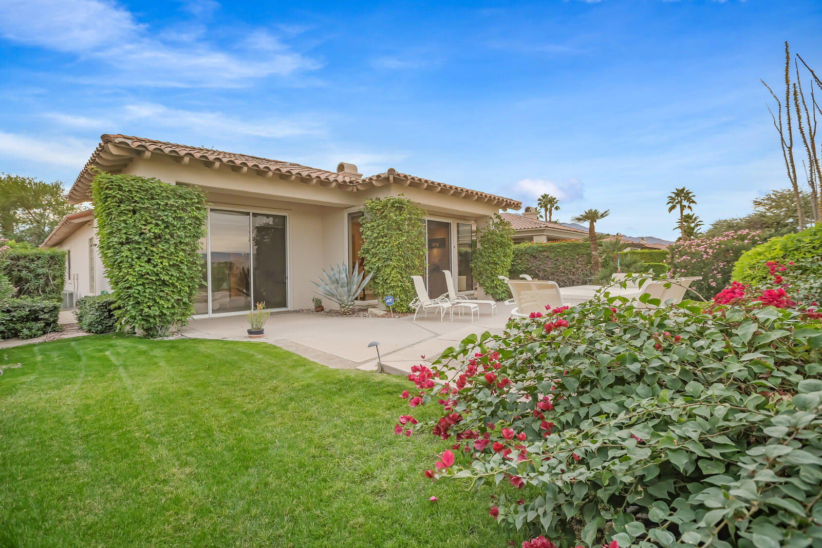 128 Loch Lomond Road Rancho Mirage, CA 92270 - Photo 41 of 42 a front view of a house with a porch