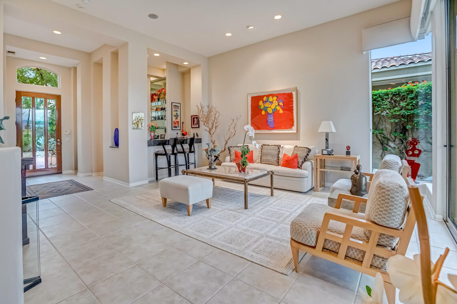 128 Loch Lomond Road Rancho Mirage, CA 92270 - Photo 7 of 42 a living room with furniture and a flat screen tv