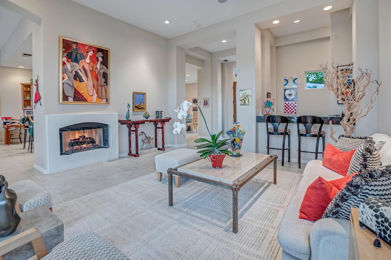 128 Loch Lomond Road Rancho Mirage, CA 92270 - Photo 8 of 42 a living room with furniture and a fireplace