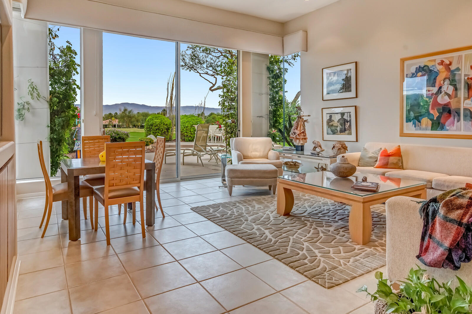 128 Loch Lomond Road Rancho Mirage, CA 92270 - Photo 9 of 42 a living room with furniture a rug and a large window