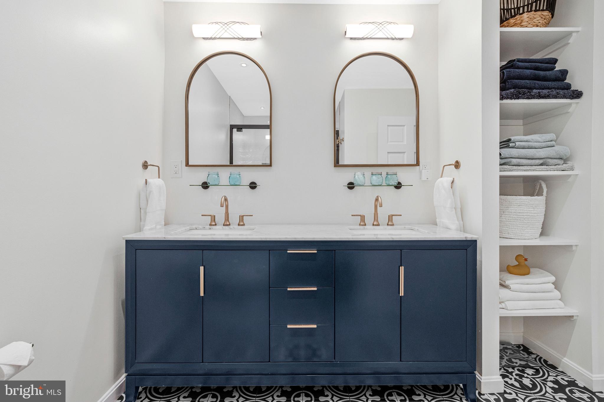 500 H Street Southwest Washington, DC 20024 - Photo 18 of 54 a bathroom with a double vanity sink and a mirror