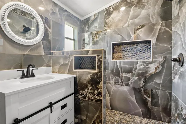 a bathroom with a sink a mirror and a toilet