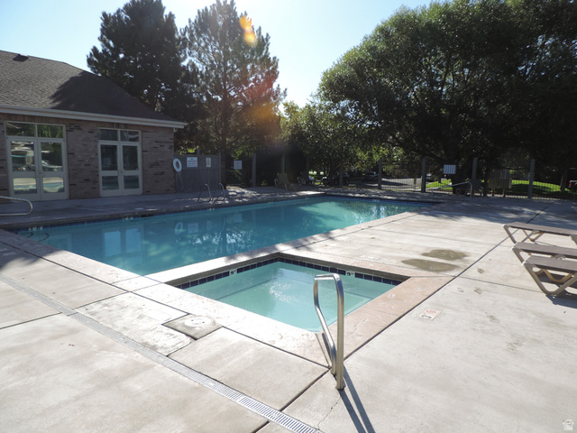 8198 North Cedar Springs Road, Unit 5 Eagle Mountain, UT 84005 - Photo 28 of 30 Community pool featuring a patio area and a community hot tub