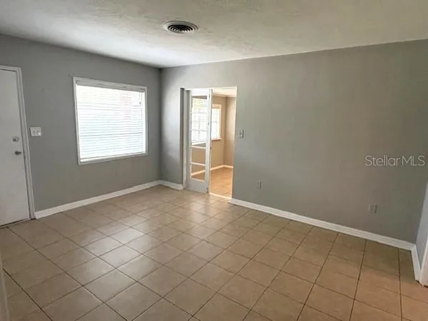 an empty room with windows