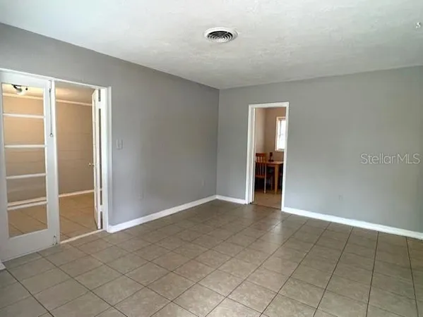 an empty room with entrance and door