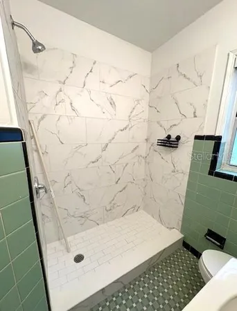 a bathroom with a sink and a shower