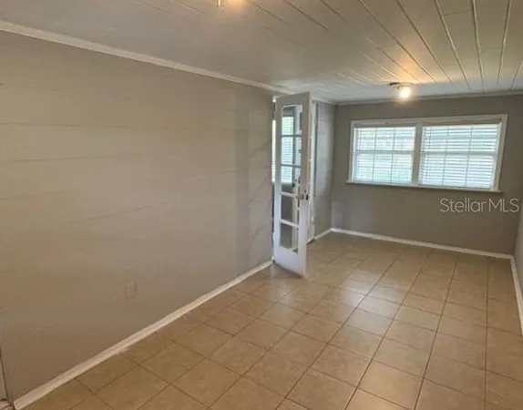 an empty room with windows