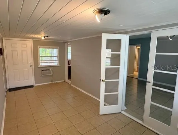 a view of an empty room with a window