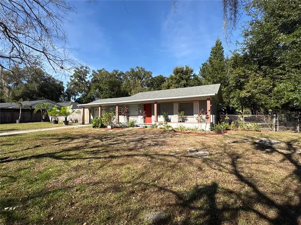 a front view of house with yard porch and green space