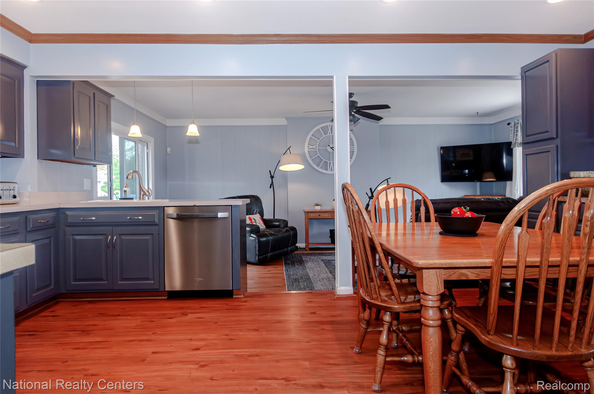 2446 Milverton Road Troy, MI 48083 - Photo 7 of 41 Dining area featuring crown molding, light wood-style flooring, and a ceiling fan