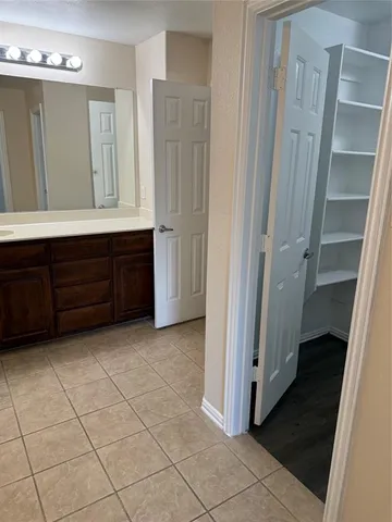 a view of walk in closet with window